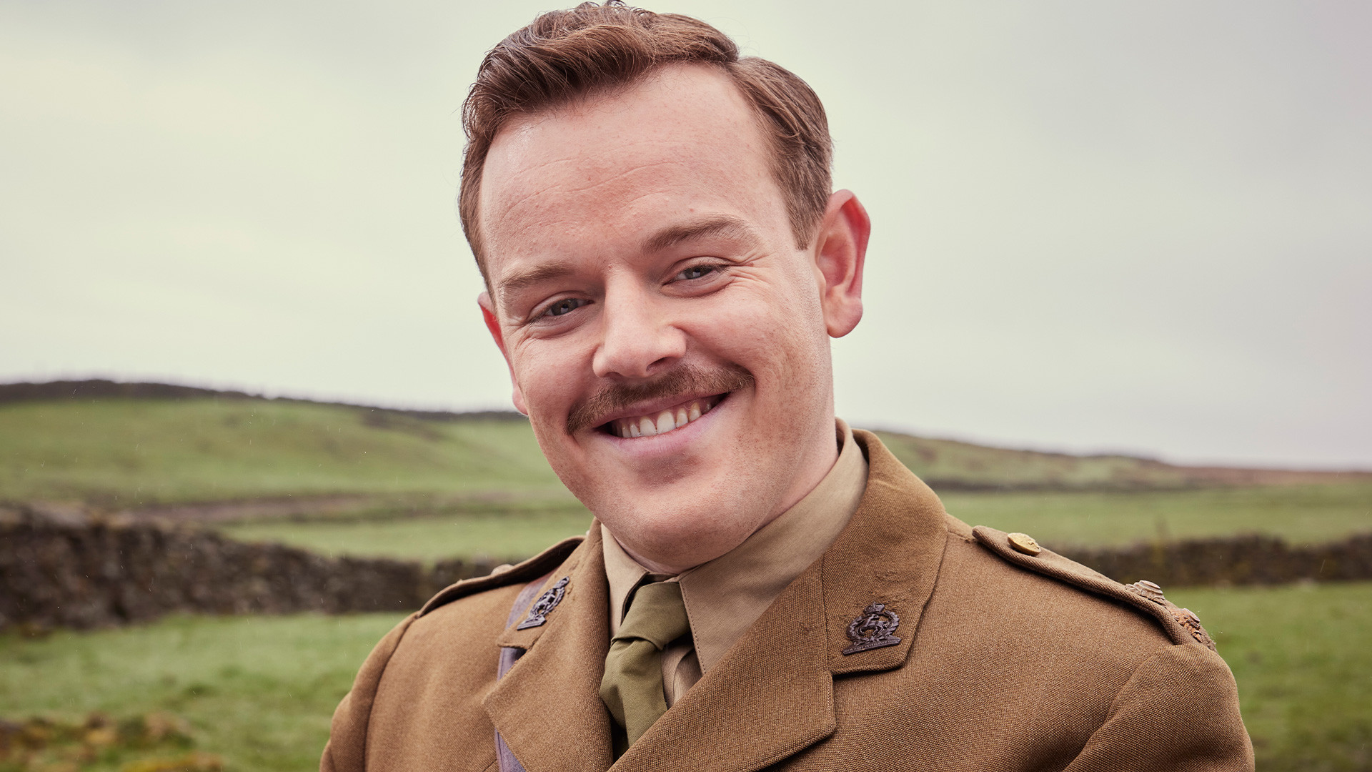 Promotional image for All Creatures Great and Small Season 5 featuring Callum Woodhouse with a mustache.