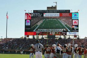 Godzillatron, a gigantic HDTV screen at Darrell K Royal-Texas Memorial Stadium, towering over the football field.