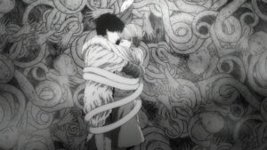 alt text: Black and white still from the Uzumaki anime featuring Kirie with spiraling hair