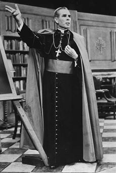 Bishop Fulton Sheen on the set of his television show, Life is Worth Living, using a blackboard to illustrate a point.