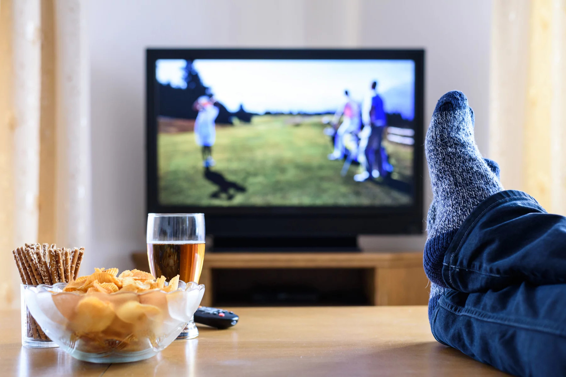 Person watching television from a couch