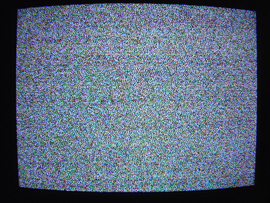 Photograph of a television with static on the screen