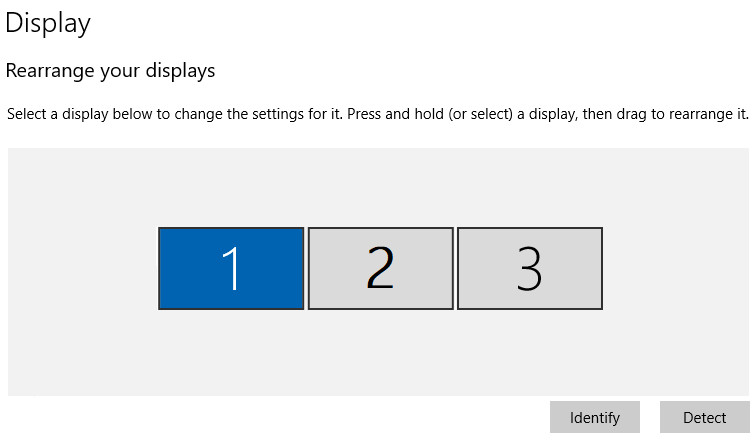 Windows Display Settings showing three extended displays.