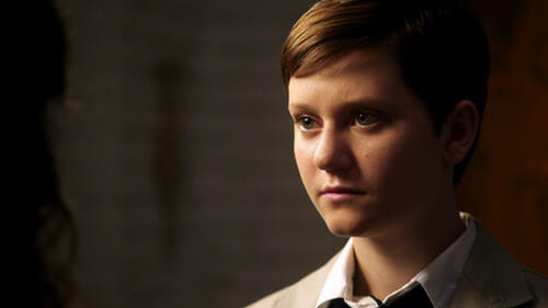 Alt: A still from a television show depicting a transgender character in a dramatic scene.