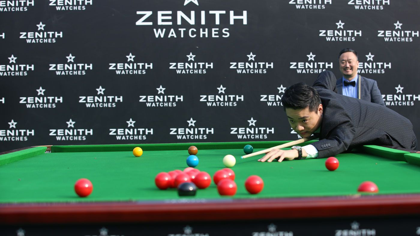 alt text: Ding Junhui playing snooker