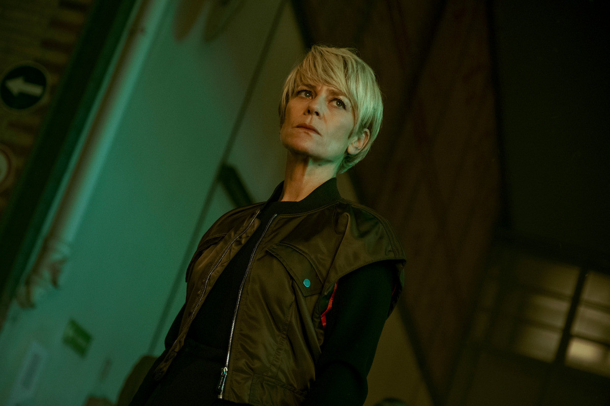 Marina Foïs as Selma, aka The Fury, wears a green vest in a still image from Season 1 of ‘Furies.’