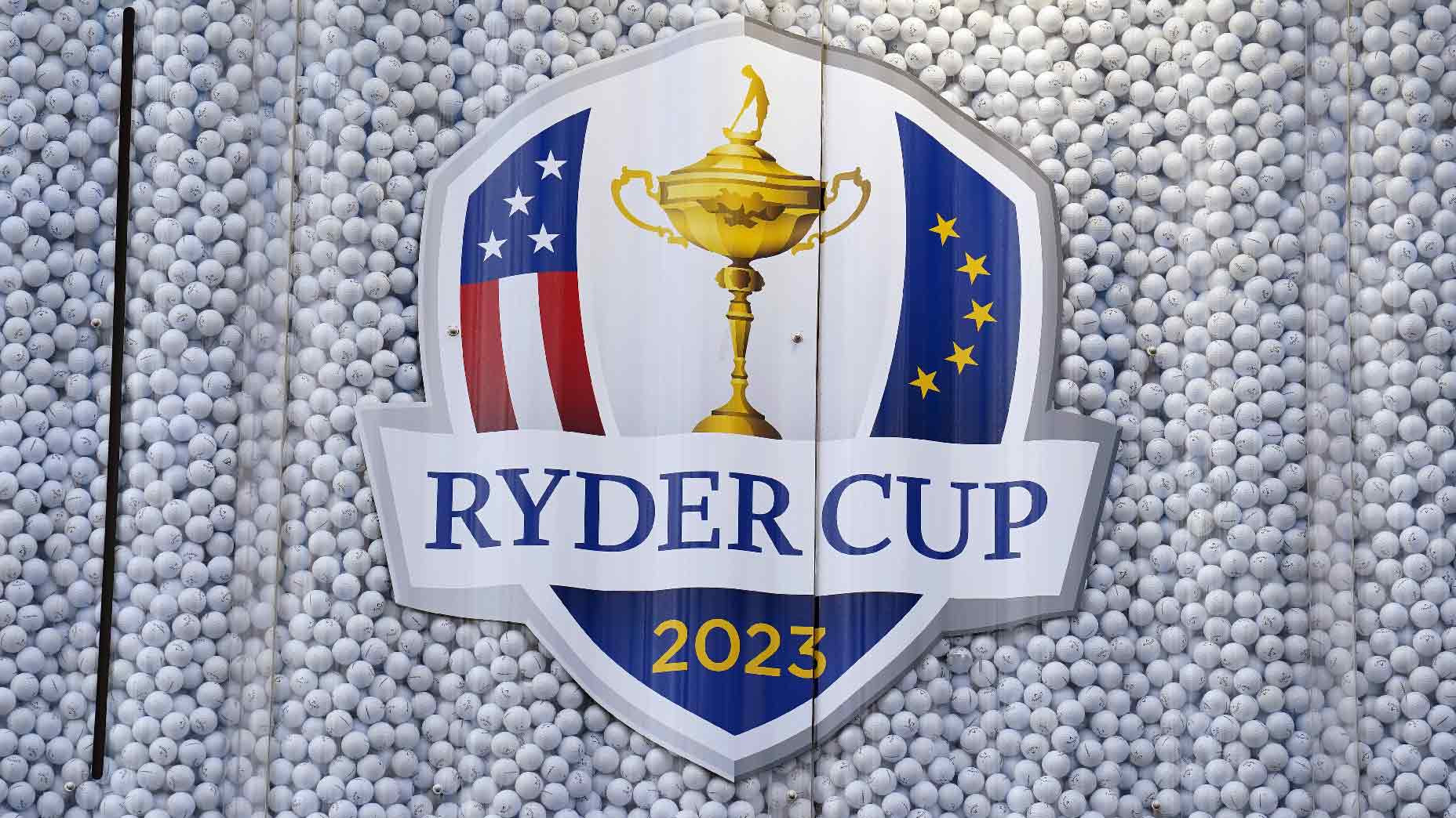 Ryder Cup trophy and team members
