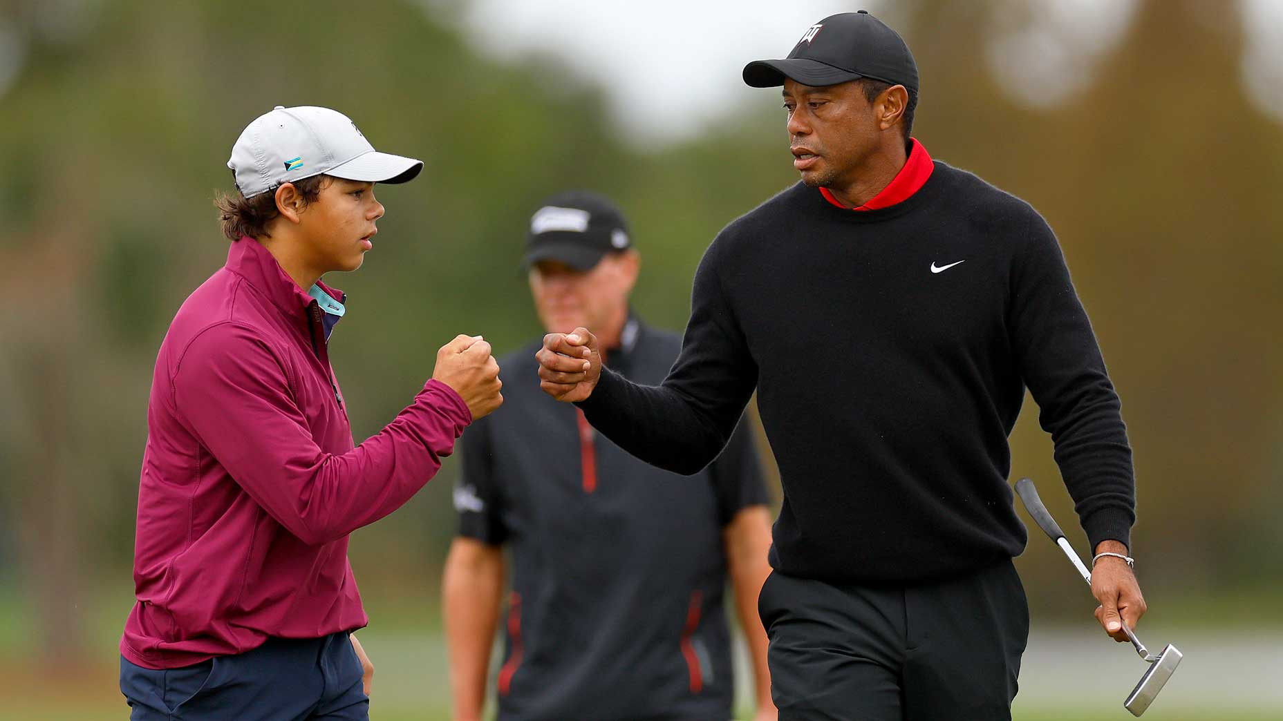 Tiger Woods and his son Charlie competing in the PNC Championship, showcasing family and golf.