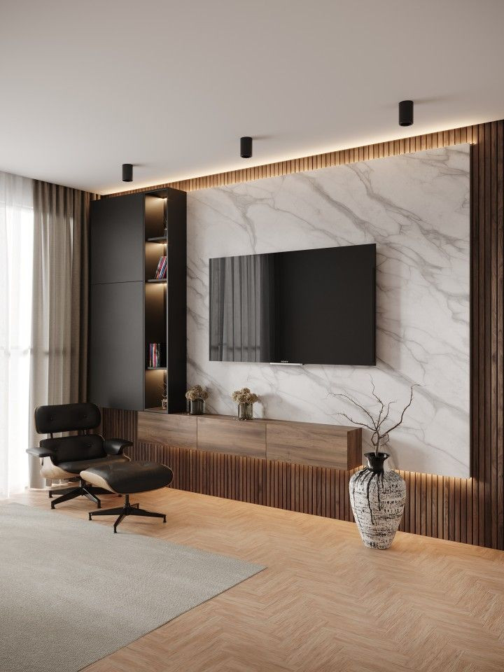 modern apartment living room with eames lounge chair in front of TV with a white marble and vertical wood slat accent wall